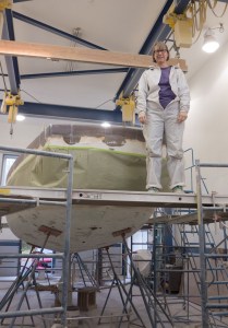 Nina is relaxing after glassing the hull to deck joint.