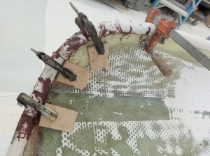 You can see the saw kerfs that let the pipe bend.