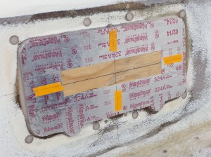 The mold is covered in metal tape, waxed and mounted in the opening. Then the gap is filled with epoxy putty. A pastry bag works great.