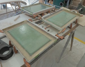 The lids have had the foam core added and have been fiberglassed over to make them stronger and to repair the back lip.