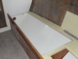 Easier to paint before the tank goes in. 