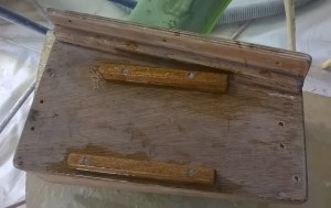 Muffler platform. The engine uses a wet exhaust, so water is mixed with the exhaust gas to cool it and it travels down a hose and out of the transom of the boat.