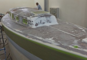 The deck has been sanded. You can see spots of putty that were used to fill imperfections