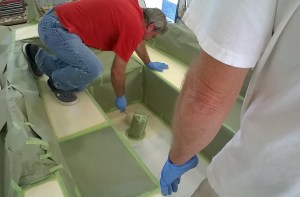Bill rolling on the Durabak on the cockpit sole with Randy giving guidance and quality control.