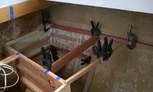 Epoxying the pantry cleats in place.   